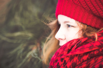 Natural redhead with red scarf in winter 
