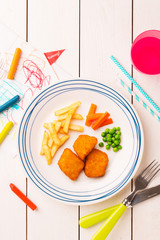 Kid's meal (dinner) - chicken nuggets, fries, carrot and green peas