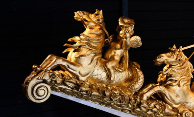 Fototapeta na wymiar Golden ornaments on a royal boat