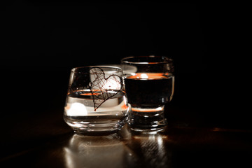 beautiful glasses in the flame of a candle