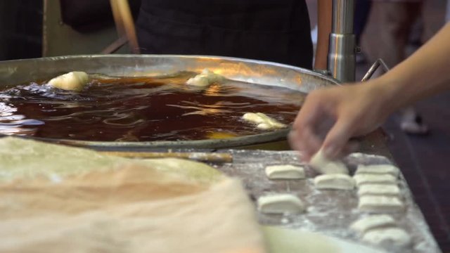 Chef preparing Fried Bread Stick, (youtiao, patongko, Banh Quay)