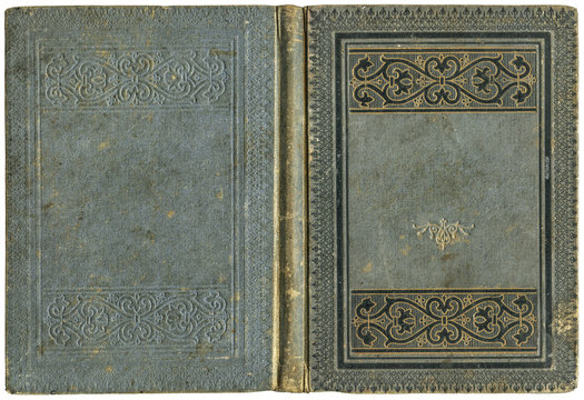 Fototapeta Old open book cover in grey canvas with embossed golden abstract and floral decorations (circa 1880), isolated on white, beautiful details