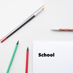 School accessories. Back to school. Copy space. Frame with school supplies on a white background. Flat lay, top view.