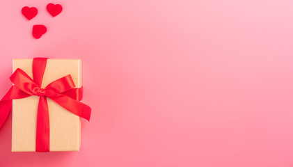 Giving present and celebration concept at Valentine's day, anniversary, mother's day and birthday surprise on pink background, copyspace, topview