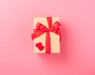 Giving present and celebration concept at Valentine's day, anniversary, mother's day and birthday surprise on pink background, copyspace, topview
