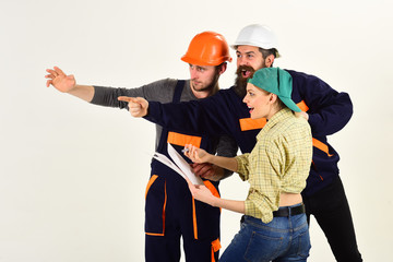 Building relationships. Men and woman builders working in team. Group of constructing engineers and...
