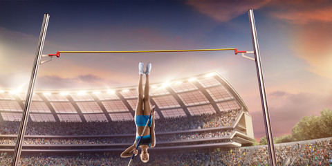 Young female pole vault athlete with pole bar. Women in sport clothes jump over the pole bar at athletic sport track in professional stadium