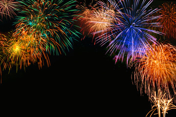 Fireworks of various color bursting against on  black background in festival holiday happy new year