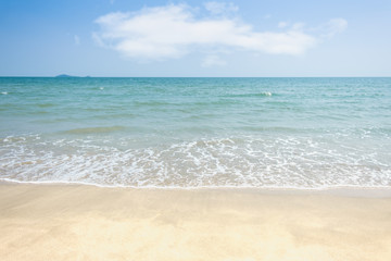 Fototapeta na wymiar Beach sand with sea wave and sky background and summer day