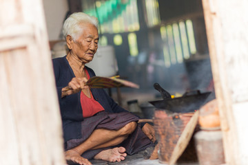 Senior asian woman chef cook in the kitchen, Traditional in Thailand