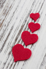 Red hearts on wooden table, valentine's background