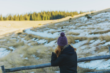 The girl walks in the mountainous valleys.