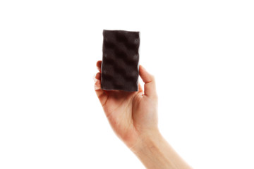 Black sponge for dishes in hand isolated on white background.