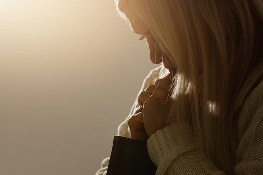 Woman Hands Praying To God With The Bible. Woman Pray For God Blessing To Wishing Have A Better Life. Begging For Forgiveness And Believe In Goodness. Christian Life Crisis Prayer To God.