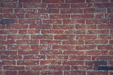 red brick wall texture grunge background with vignetted corners, may use to interior design. Interior design concept, background texture in design use.