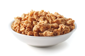 Bowl of soya chunks on white background