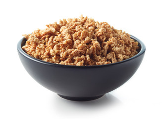 Bowl of soya chunks on white background