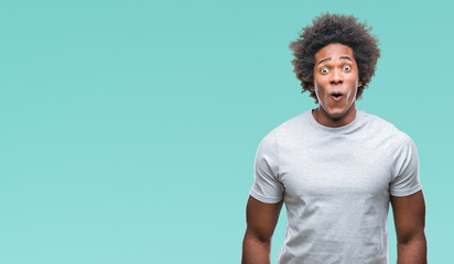 Afro american man over isolated background afraid and shocked with surprise expression, fear and excited face.