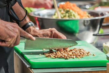 Chefs at work in a restaurant kitchen making delicious food