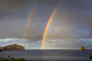 Rainbow rising from the sea