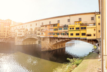 Fototapeta na wymiar Famous landmark Ponte Vecchio bridge over Arno river in Florence, Italy