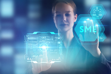 The concept of business, technology, the Internet and the network. A young entrepreneur working on a virtual screen of the future and sees the inscription: SME