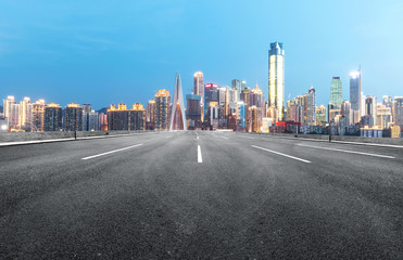 The expressway and the modern city skyline are in Chongqing, China.