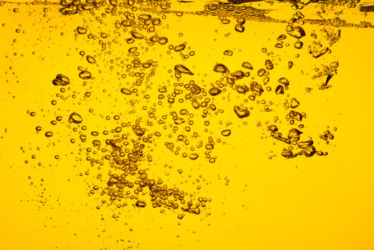 Bubble in liquid yellow color car oil or beer  juice syrup for background