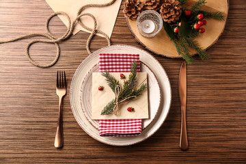 Beautiful Christmas table setting on wooden background
