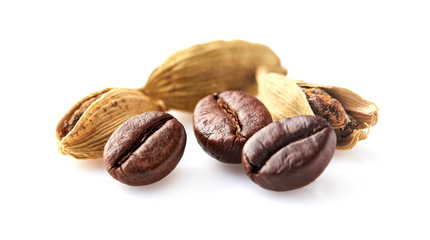 Coffee beans with cardamon isolated on white background