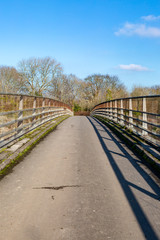 Fototapeta na wymiar Looking over a foot bridge in Sussex, on a sunny winters day