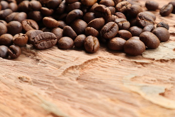 Coffee beans on wood background