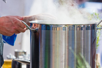 Chefs at work in a restaurant kitchen making delicious food