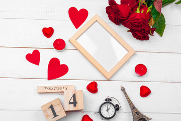 Creative Valentine Day romantic composition flat lay top view love holiday celebration red heart calendar date white wooden background