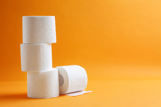 Rolls Of Toilet Paper On Color Background