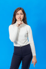 Young beautiful girl isolated on blue background