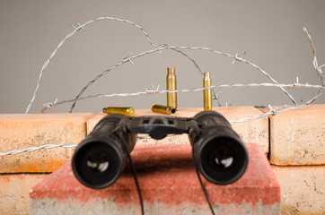 Spy glass atop of a wall