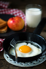 Breakfast  fried Eggs with toast apple and milk
