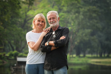 Portrait of Senior couple retirement Man and woman happy in park together