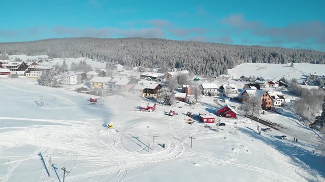 Snowfall of holls, forests and frozen river