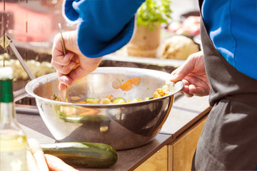 Chefs at work in a restaurant kitchen making delicious food