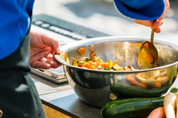 Chefs at work in a restaurant kitchen making delicious food