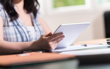 Fototapeta premium Businesswoman using a tablet