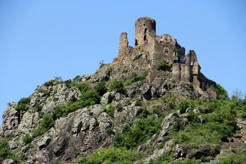Fototapeta na wymiar ruins of an old medieval fortress on the top of a mountain in France