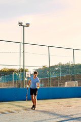 Tennis player ready to serve on court