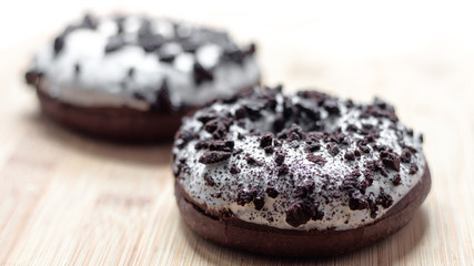 Chocolate doughnut closeup with blurred background and bright style