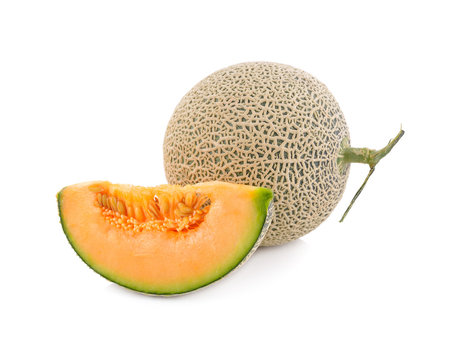 whole and cut piece ripe Japanese orange melon with stem on white background