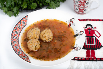 Top view of plate with meatballs soup, traditional plate of the Romanian cuisine