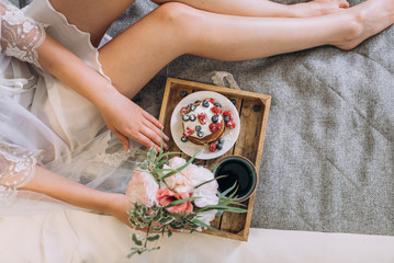 breakfast in bed to the bride. soft focus