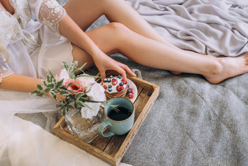 Obraz na płótnie Canvas breakfast in bed to the bride. soft focus